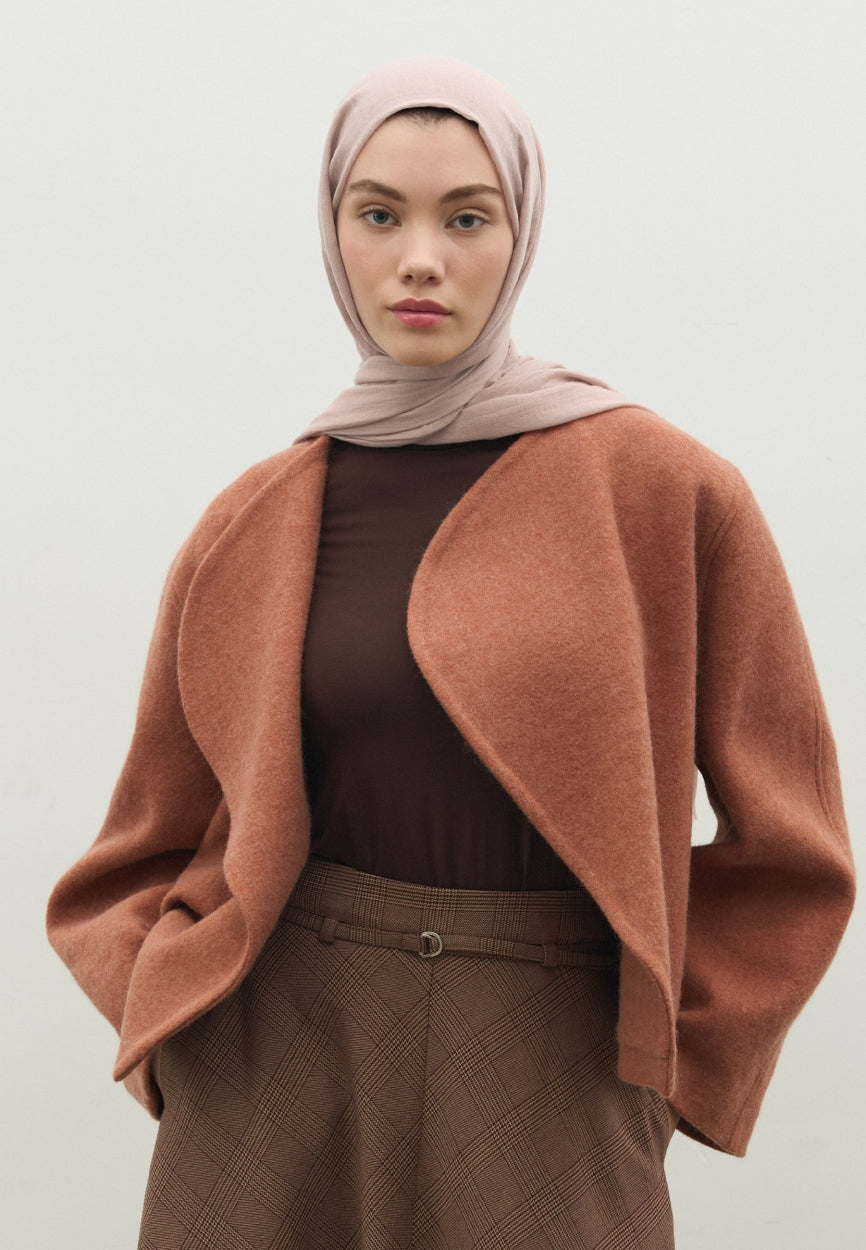 Detail shot of Powder Pink Cashmere Textured Paisley Powder fabric and stitching