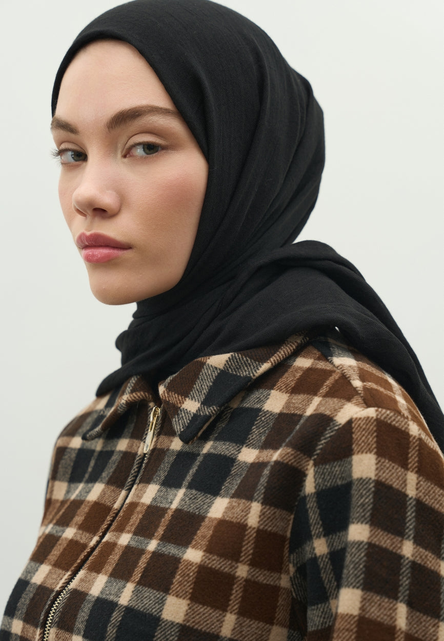 Detail shot of Black Cashmere Textured Scarf fabric and stitching