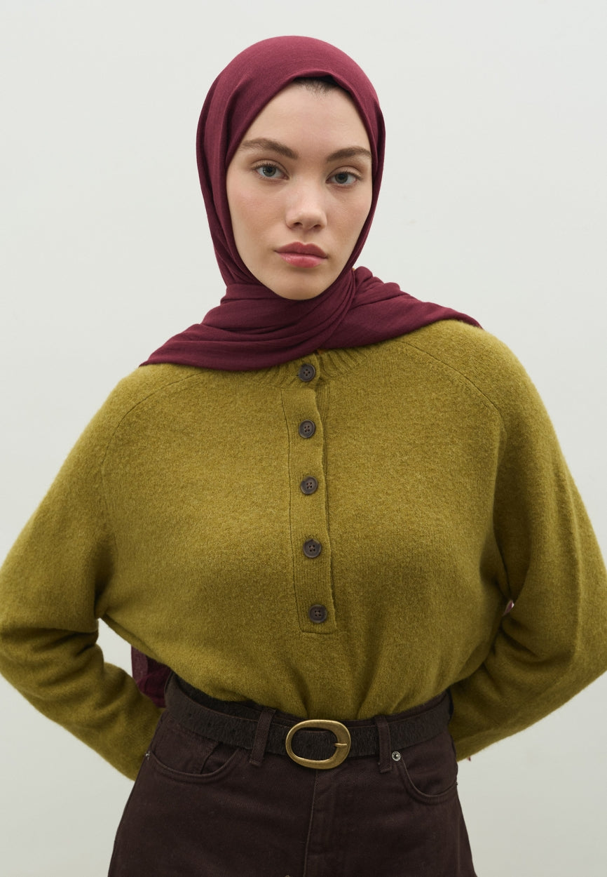 Detail shot of Bruise Cashmere Textured Scarf Cherry fabric and stitching