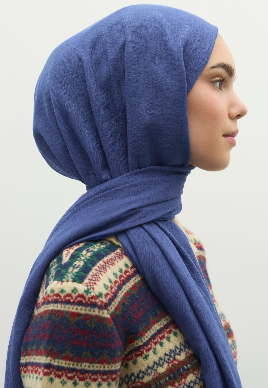 Detail shot of Blue Cashmere Textured Scarf Dark fabric and stitching