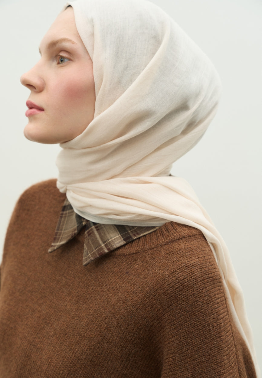 Detail shot of Ivory Cashmere Textured Scarf fabric and stitching