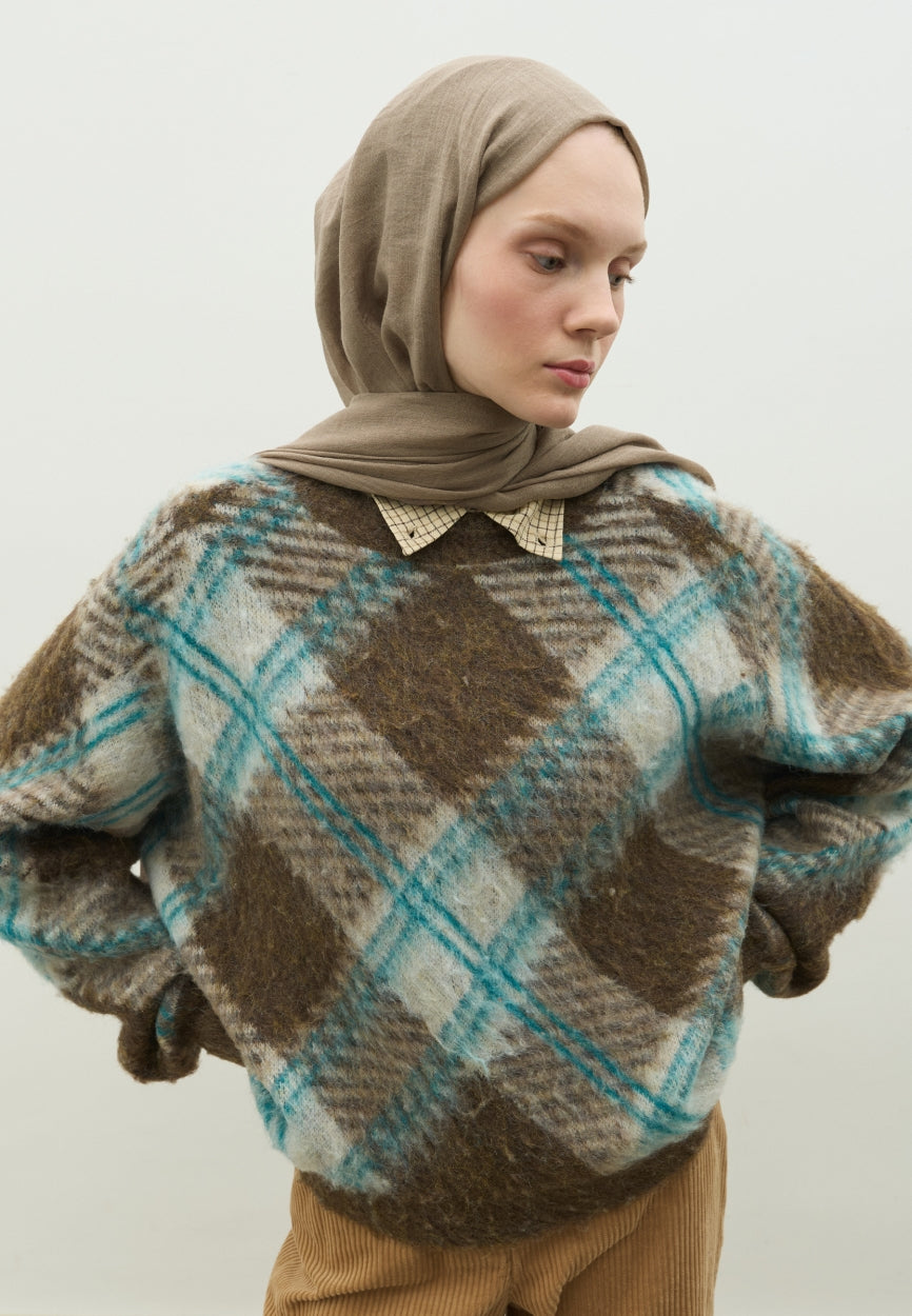 Detail shot of Mink Cashmere Textured Scarf fabric and stitching