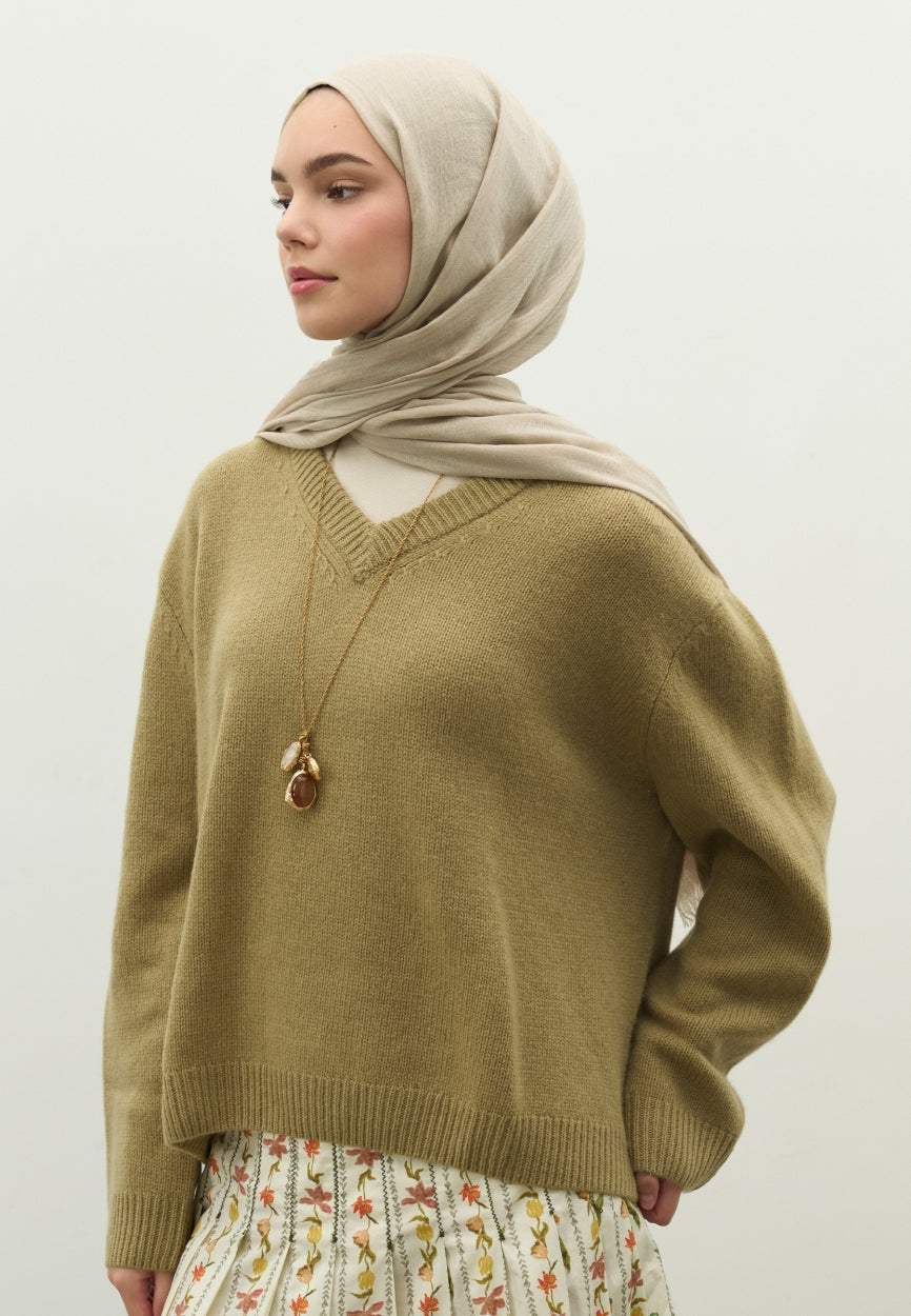 Detail shot of Beige Cashmere Textured Scarf Natural fabric and stitching