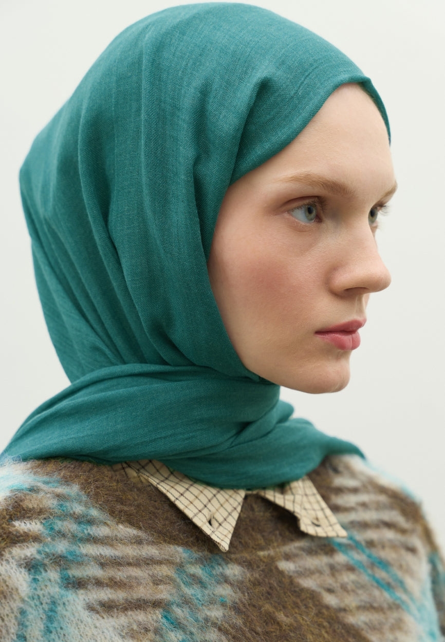 Detail shot of Green Cashmere Textured Scarf Oil fabric and stitching