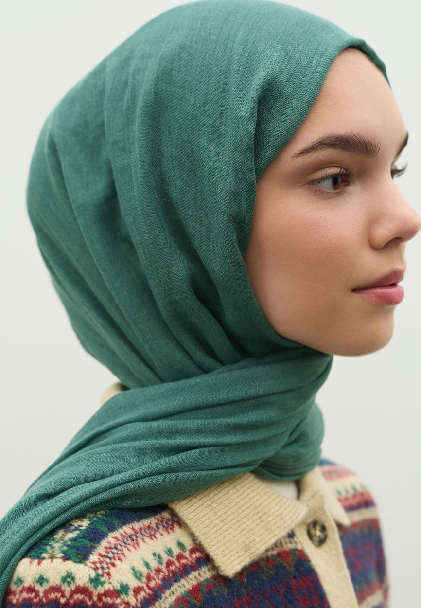 Detail shot of Green Cashmere Textured Scarf Pine fabric and stitching