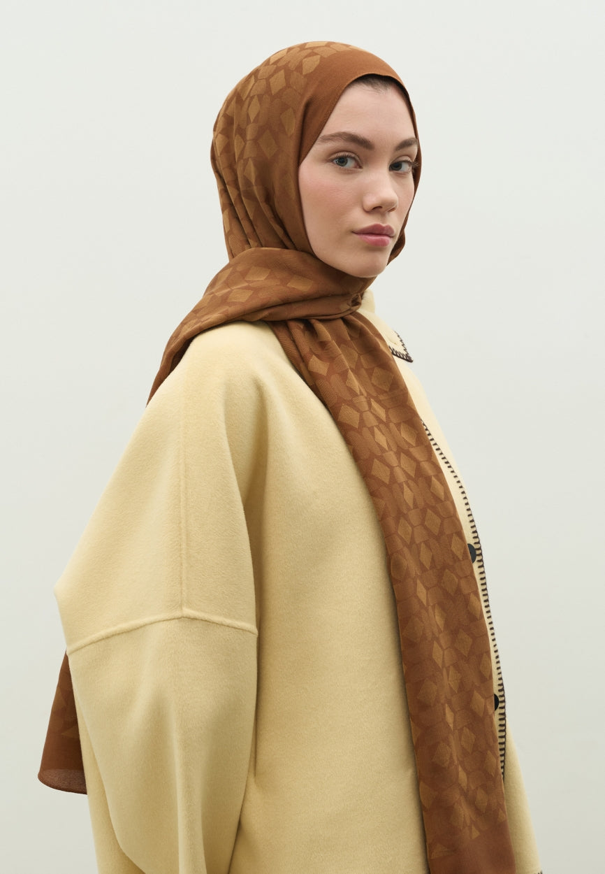 Detail shot of Walnut Oslo Cotton Jacquard Flush Hijab fabric and stitching