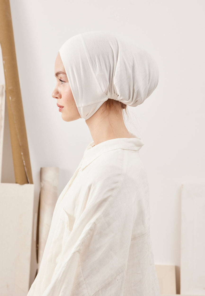 Cream Large Volume Practical Bonnet side angle showing elegant silhouette