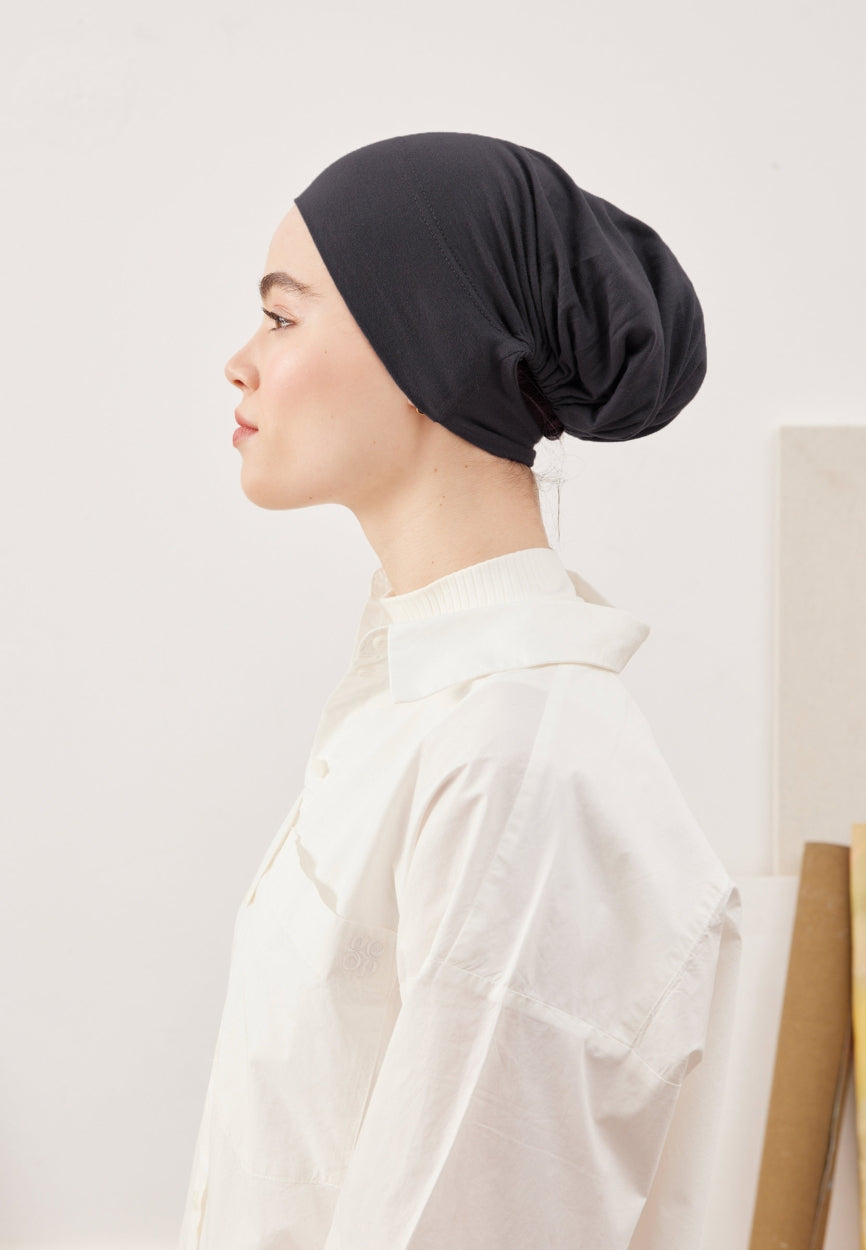 Back view of Anthracite Large Volume Practical Bonnet displaying full coverage design