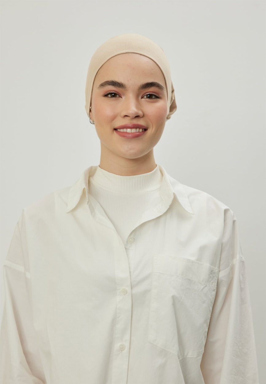 Beige Large Volume Tie Bonnet side angle showing elegant silhouette