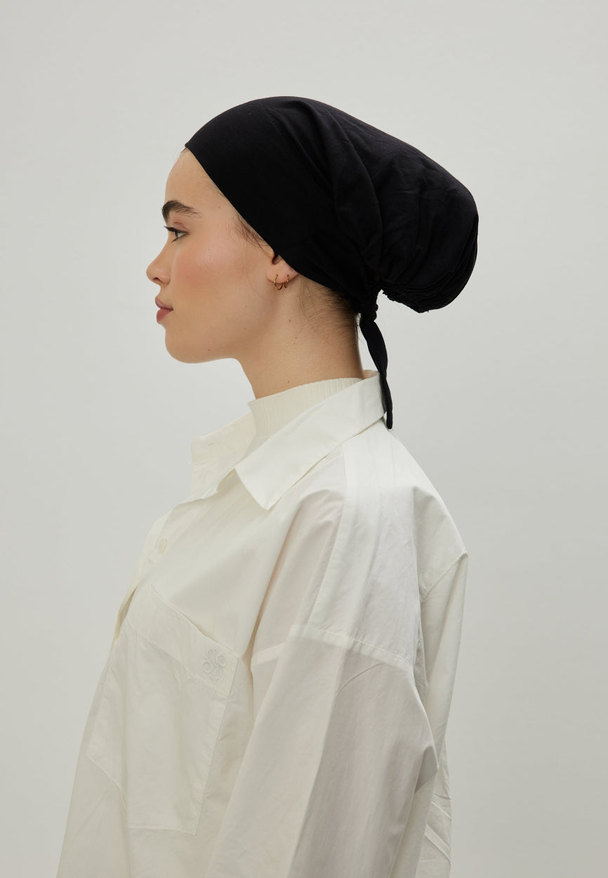 Black Large Volume Tie Bonnet side angle showing elegant silhouette