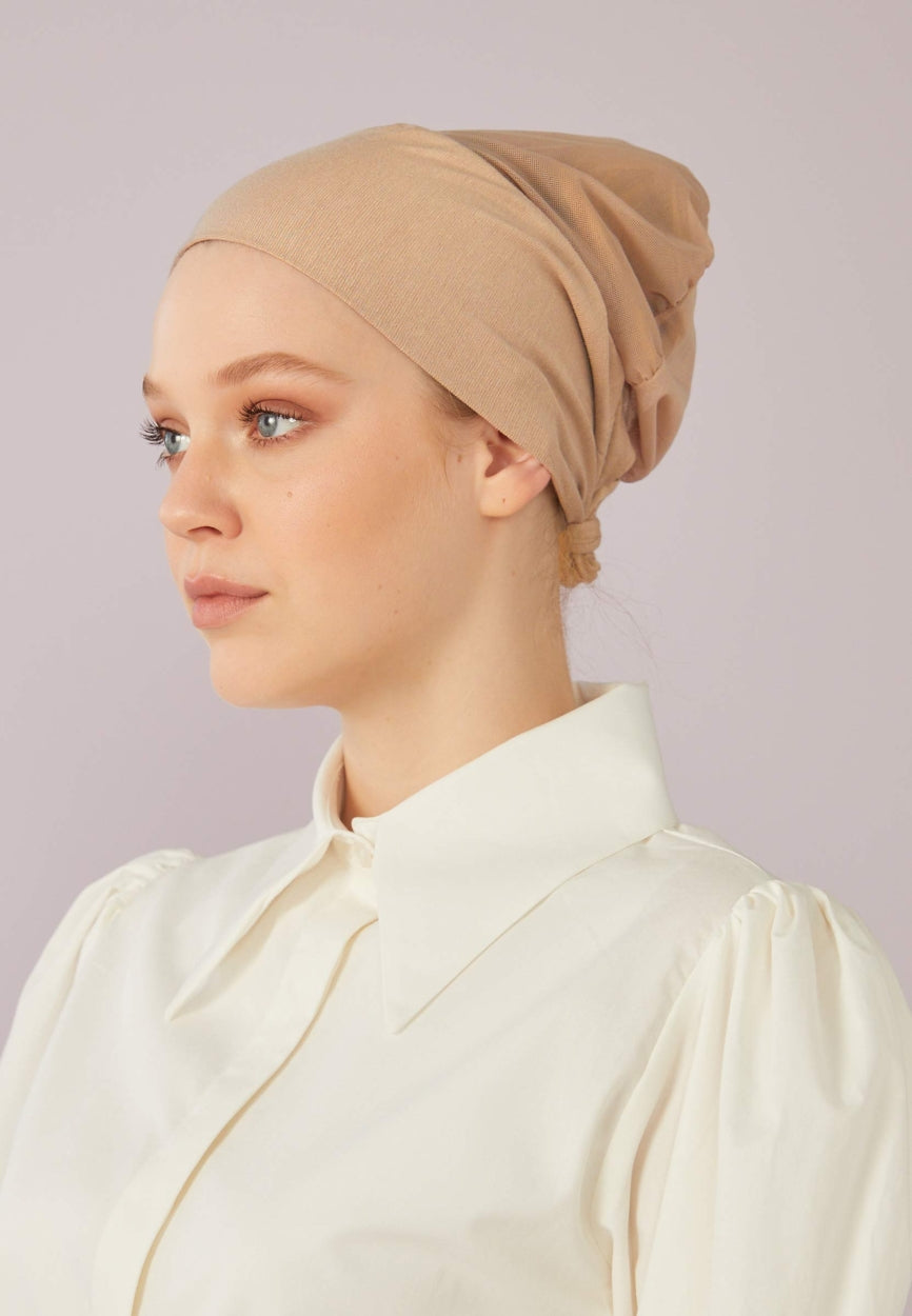 Beige Seamless Mesh Plain Bonnet side angle showing elegant silhouette