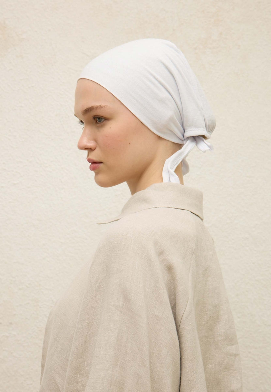 White Seamless Plain Bonnet (Eva) side angle showing elegant silhouette