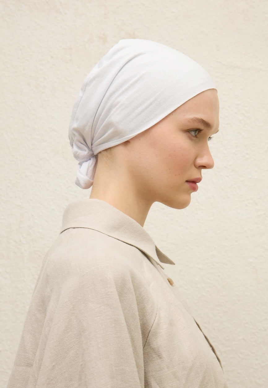 Back view of White Seamless Plain Bonnet (Eva) displaying full coverage design