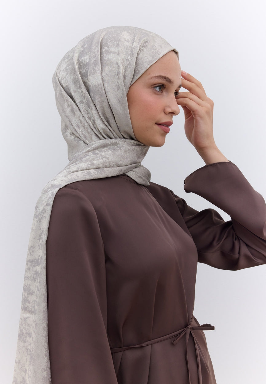Qivola Silky Shimmery Scarf in Beige, full-length view