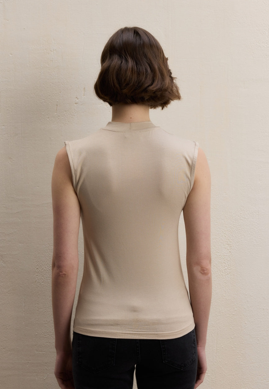 Qivola Sleeveless Bamboo Body Undershirt in Nude, back view